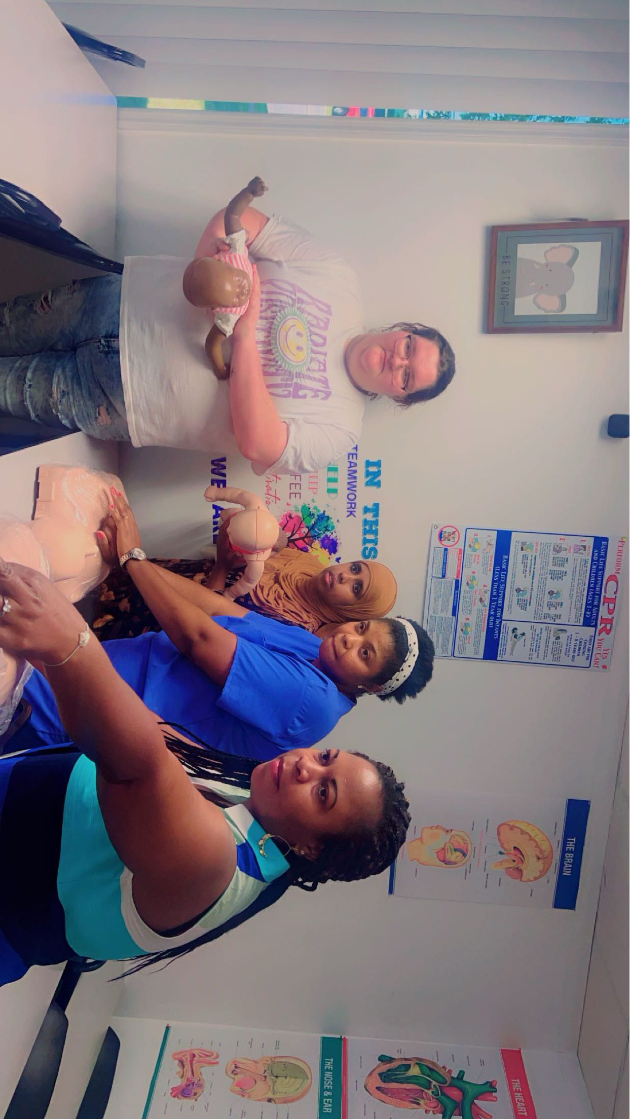 Allure students practicing CPR with infant and adult training mannequins